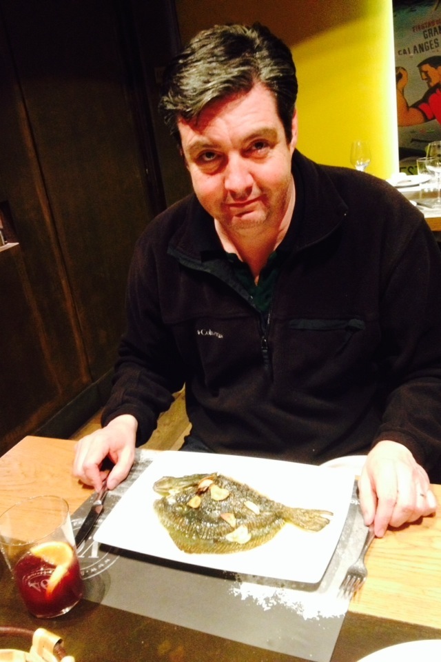 Someone is looking a little nervous before digging into his extremely fresh and whole fish...